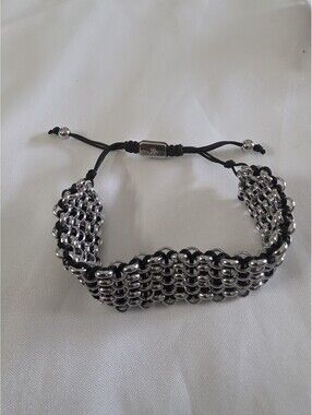 Nogu Silvertone And Black Cord Adjustable Bracelet